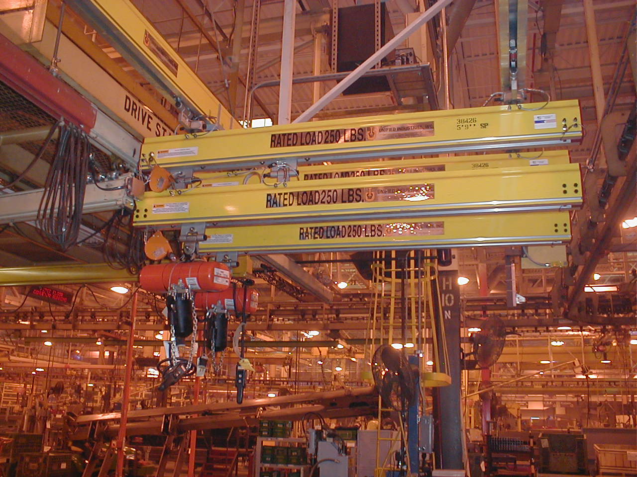An enclosed track system used as a projecting workstation crane